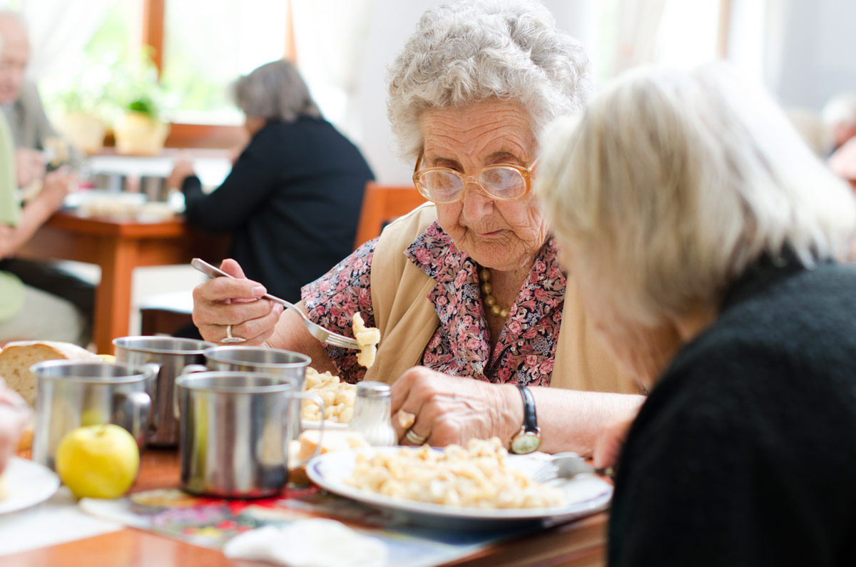 Senior Eating a Meal at Nanaimo Seniors Independent Living Community